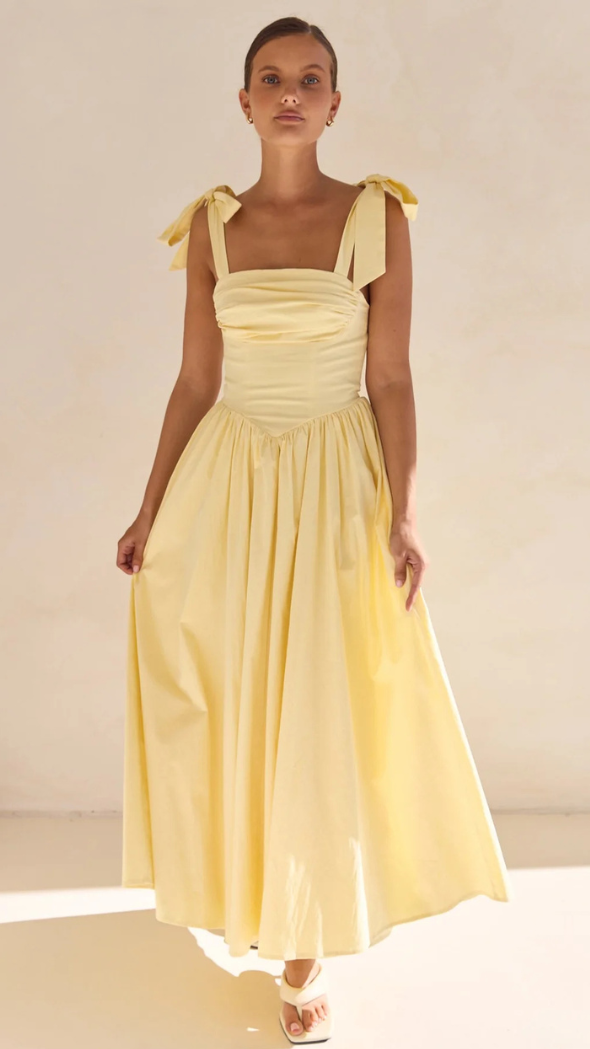 butter yellow Quinn maxi dress with adjustable shoulder ties, ruching on the bust and v-shaped waistline